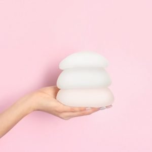 Do breast implants initially seem smaller?